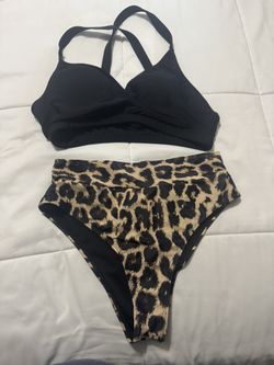 Leopard print high-waisted bikini bottoms and black halter top with adjustable straps  Size large top and bottom 