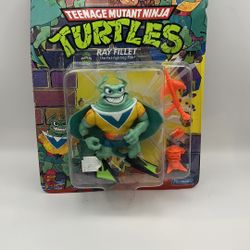 TMNT Teenage Mutant Ninja Turtles Ray Fillet Yellow Variant Playmates 1990. Plastic is lifting on top but has not come loose. Cardboard is bent 