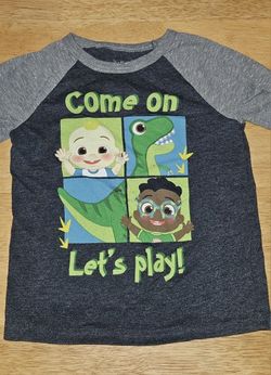 CoComelon boys' short-sleeve t-shirt featuring JJ, Cody, and a dinosaur. 