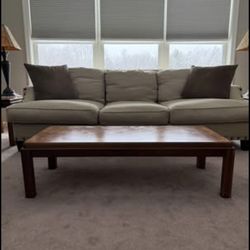 Oatmeal colored studded sofa