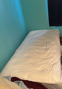 Twin Mattress with White Cover Boxspring and Frame