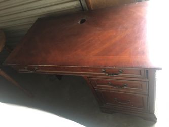 Antique looking wood L-shaped desk. 150