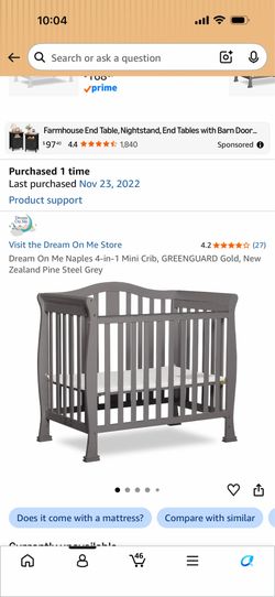 Gray mini crib and mattress