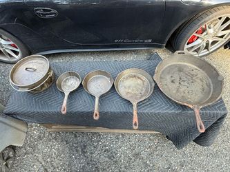 Set of five cast-iron camping set skillet and Dutch oven
