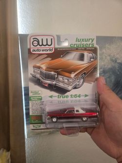 Autoworld 76' Coupe Deville Ultra Red Chase.