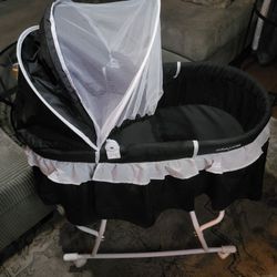 Black Bassinet With White Ruffles 