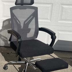 Reclining office chair with footstool