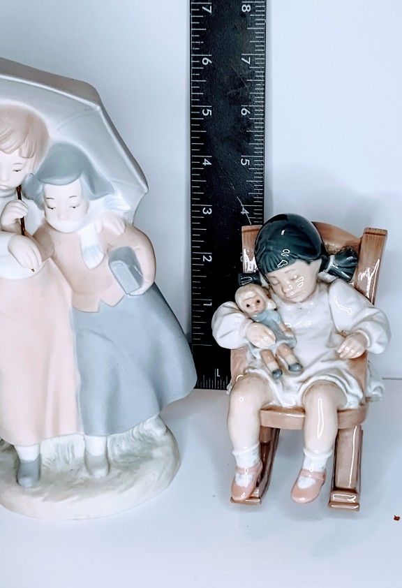 Two LLadro Figurines
