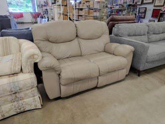 Beige loveseat recliner