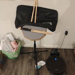 Practice drum pad with sticks