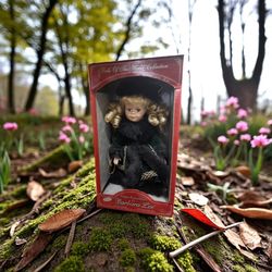 Petite Porcelain doll from the "Dolls Of The World Collection" by Barbara Lee. 