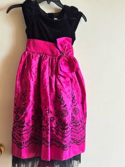 Elegant girls dress with a black velvet top and vibrant red and black floral embroidery with touch of sequins