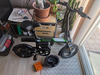 Folding e bike with helmet, charger and spare tube