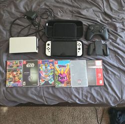 Nintendo switch OLED With 6 games, 2 controllers, and a carrying case
