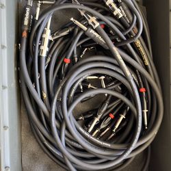The image displays a collection of Roland Roadhog Touring Series instrument cables featuring straight 1/4-inch plugs