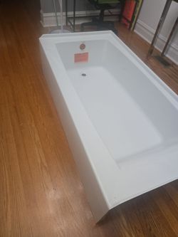 White Kohler bathtub.