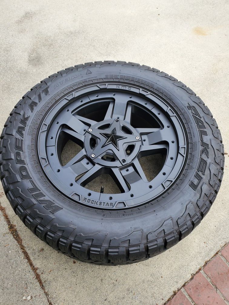 4-20"Rockstar rims/ 33"Falken Wildpeak tires 6x 135 and 6x5.5 dual bolt pattern with two different inserts, one red, one black, can be swapped out