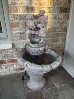 Vintage concrete water fountain waterfall