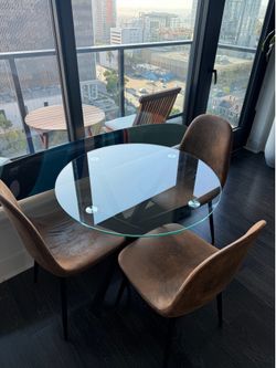 Glass dining table with chairs