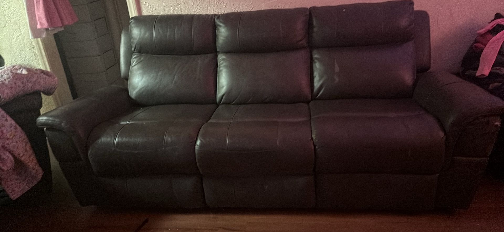 Leather reclining sofa set