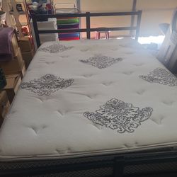 Full size bed on black frame