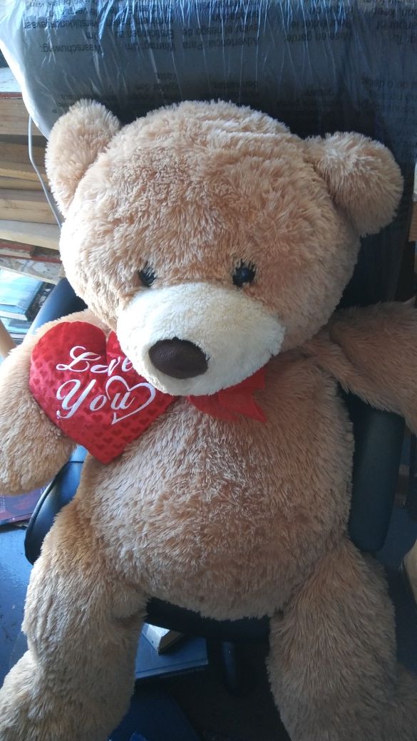 Big teddy bear with "Love You" heart