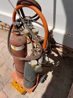 Cutting torch with oxygen and acetylene tank and cart