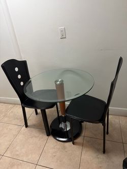 Small glass table and two chairs