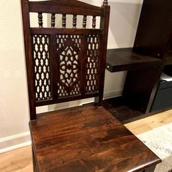 Carved wooden dining chair