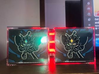 Twilight Masquerade Elite Trainer Boxes 240$ for both comes with glass cases and two free pop Pokémon’s .