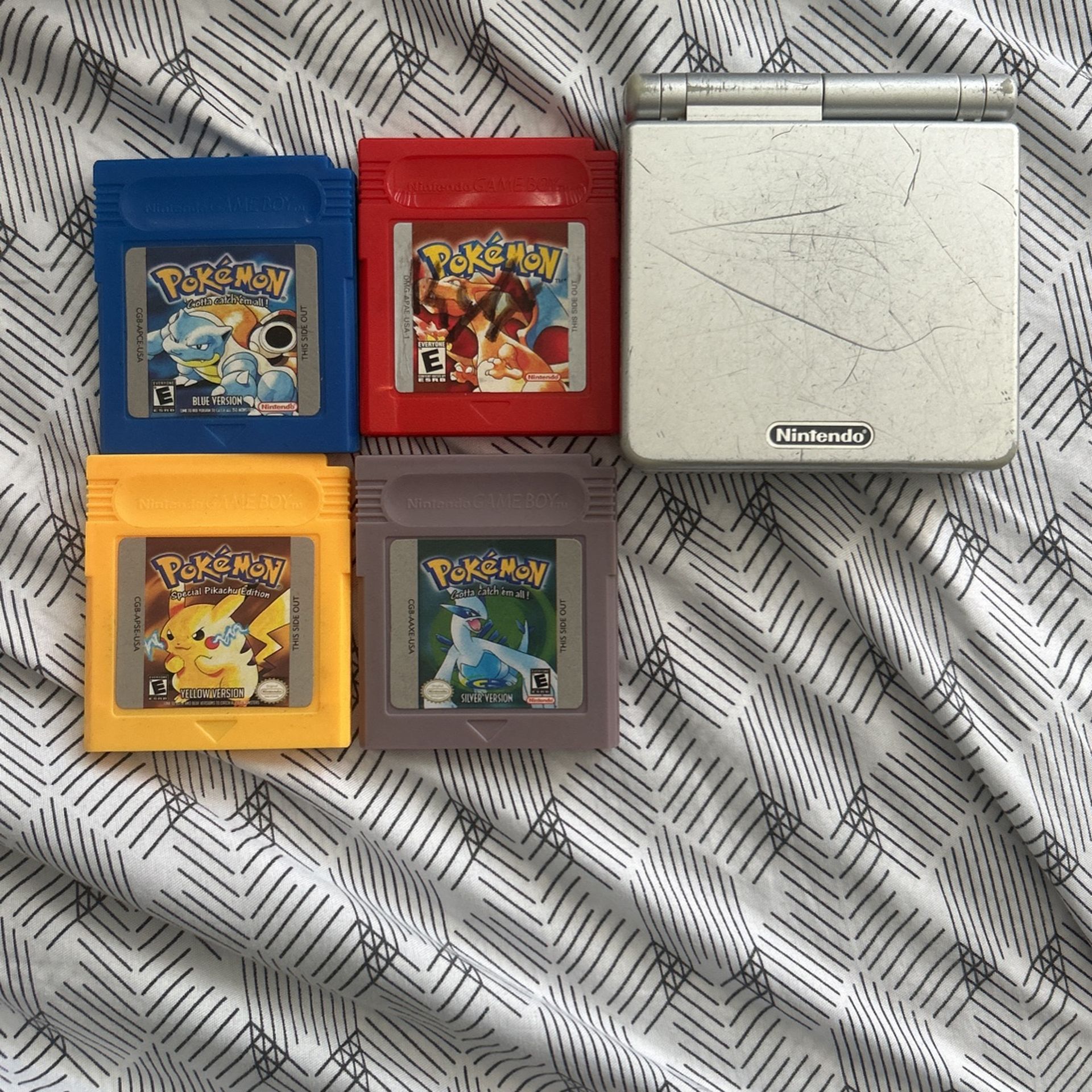Gameboy Advance SP with Pokémon Yellow Blue Red And Silver Version