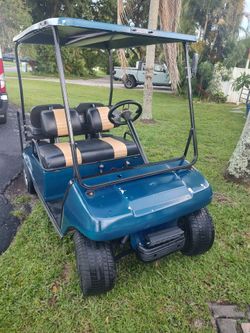 Club car golf cart needs batteries no charger, and no rips in the seats