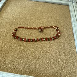 Hand crafted seed bead red and golden anklet to be worn on the ankle