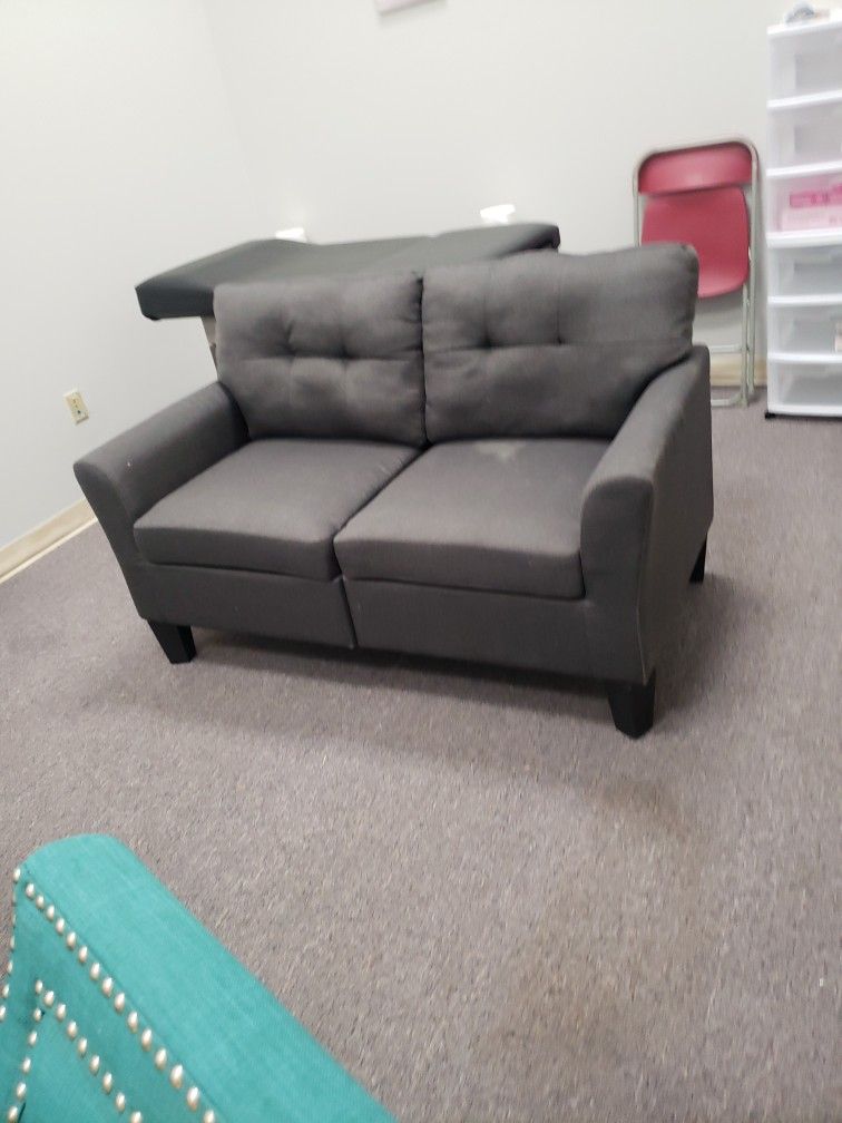 Nice grey colored loveseat $95. Needs cleaning due to being in storage.