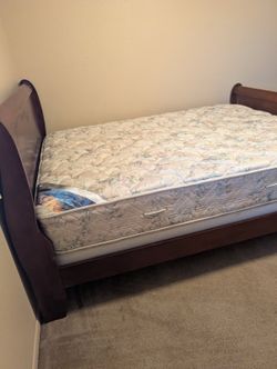 Queen sleigh bed with box spring plus Emerald series Serta mattress. Like new