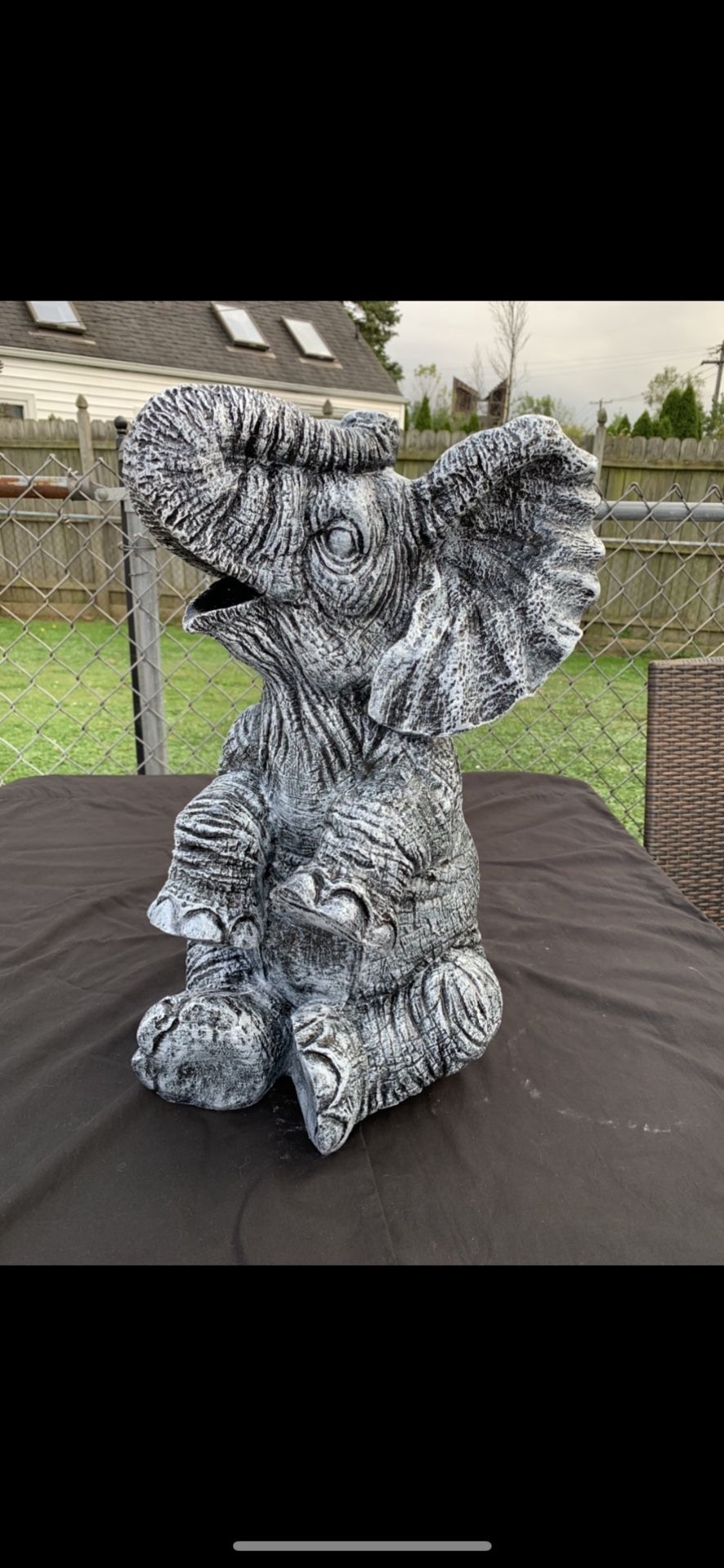 Large, happy elephant statue