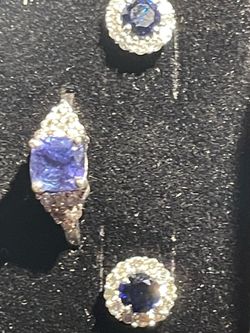 Blue Sapphire and diamond earrings mounted in 14 K white gold and a Tanzanite and diamond ring in 14 k white gold ring set