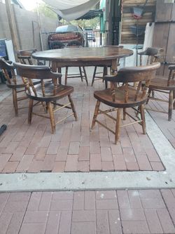 1971 vintage  real wood  table 2,extencion and 6 chairs  plus  2,capitan  chairs  total 8 chairs  mid-century  age I take best offer thanks