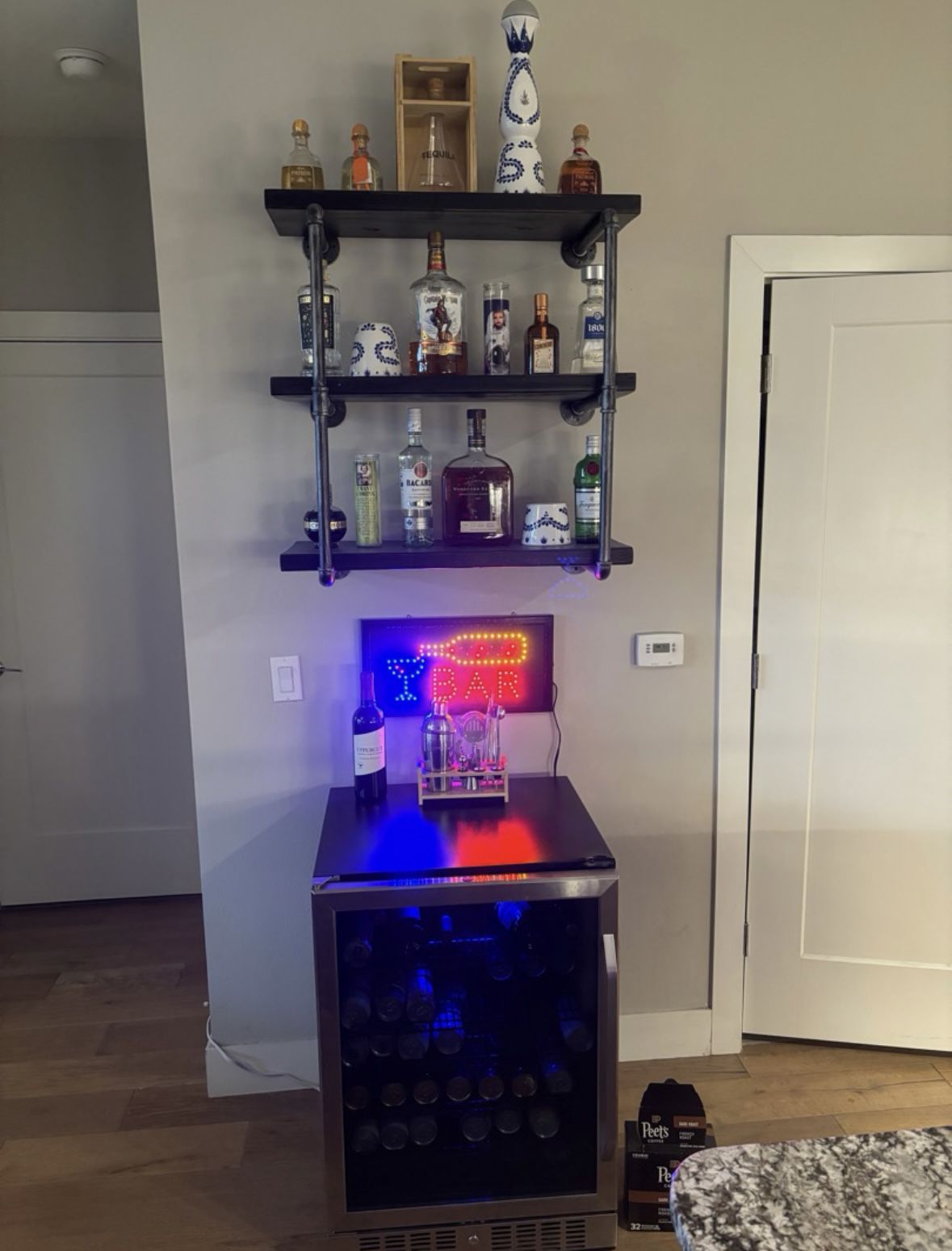 Bar Setup: Mini Fridge, Floating Shelves, Neon Sign
