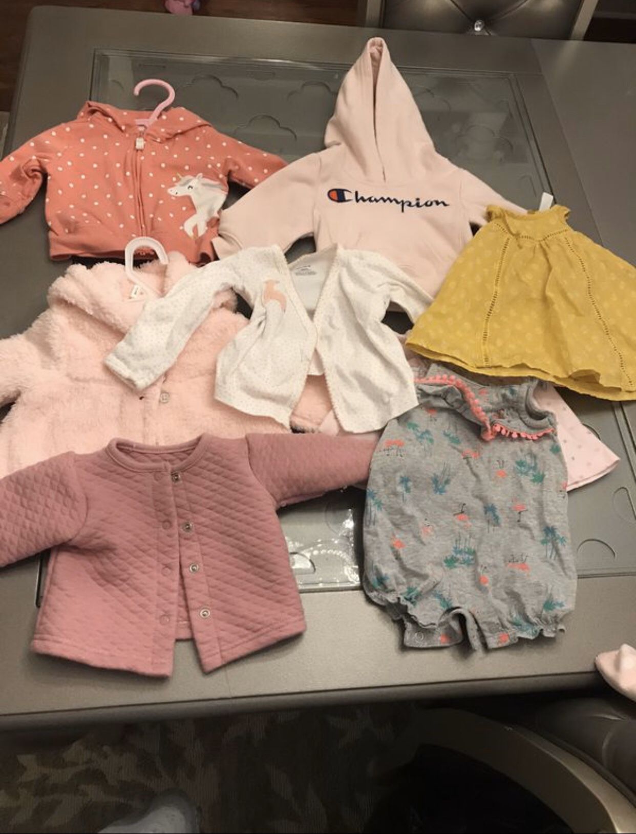 Baby clothes and teddy bears