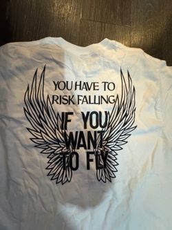 White Angel Wings Graphic Tee Risk Falling to Fly