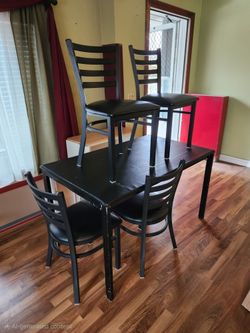 Black Metal Kitchen table with vinyl top with 4 metal chairs with vinyl seats