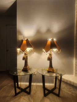 2 glass end tables and 2 elephant lambs