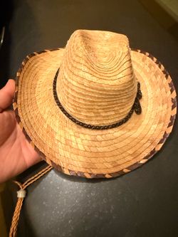 This unbranded Mexican palm leaf straw cowboy hat features a woven beige construction with a dark brown chevron trim on the brim