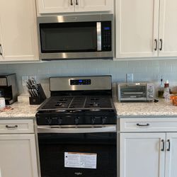 Whirlpool Microwave Black Stainless Steel and Whirlpool Stove 