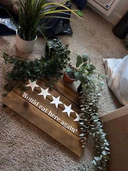 Artificial plants and kitchen sign
