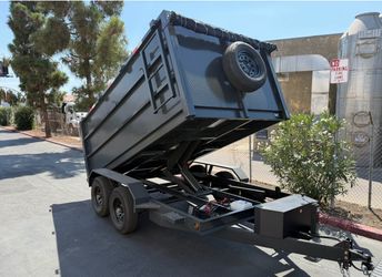 Scissor lift dump trailer