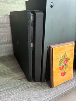 PlayStation 4 and 2 controllers with games