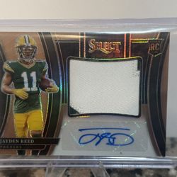 2023 Panini Select - Rookie Swatches Copper Prizm #RSW-JRE Jayden Reed /49