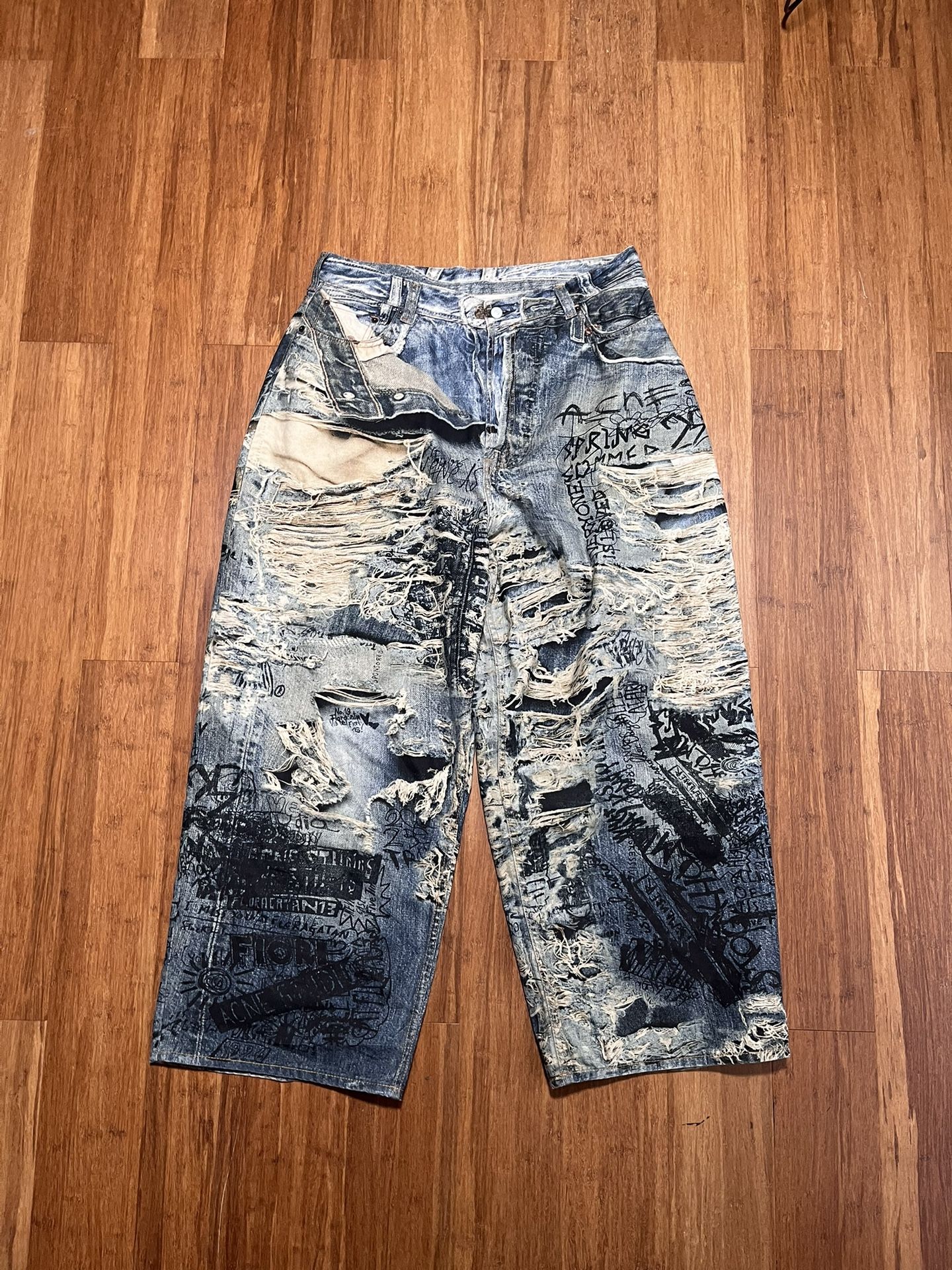 Acne Studios loose fit trompe L’oeil jeans paint splatter distressed